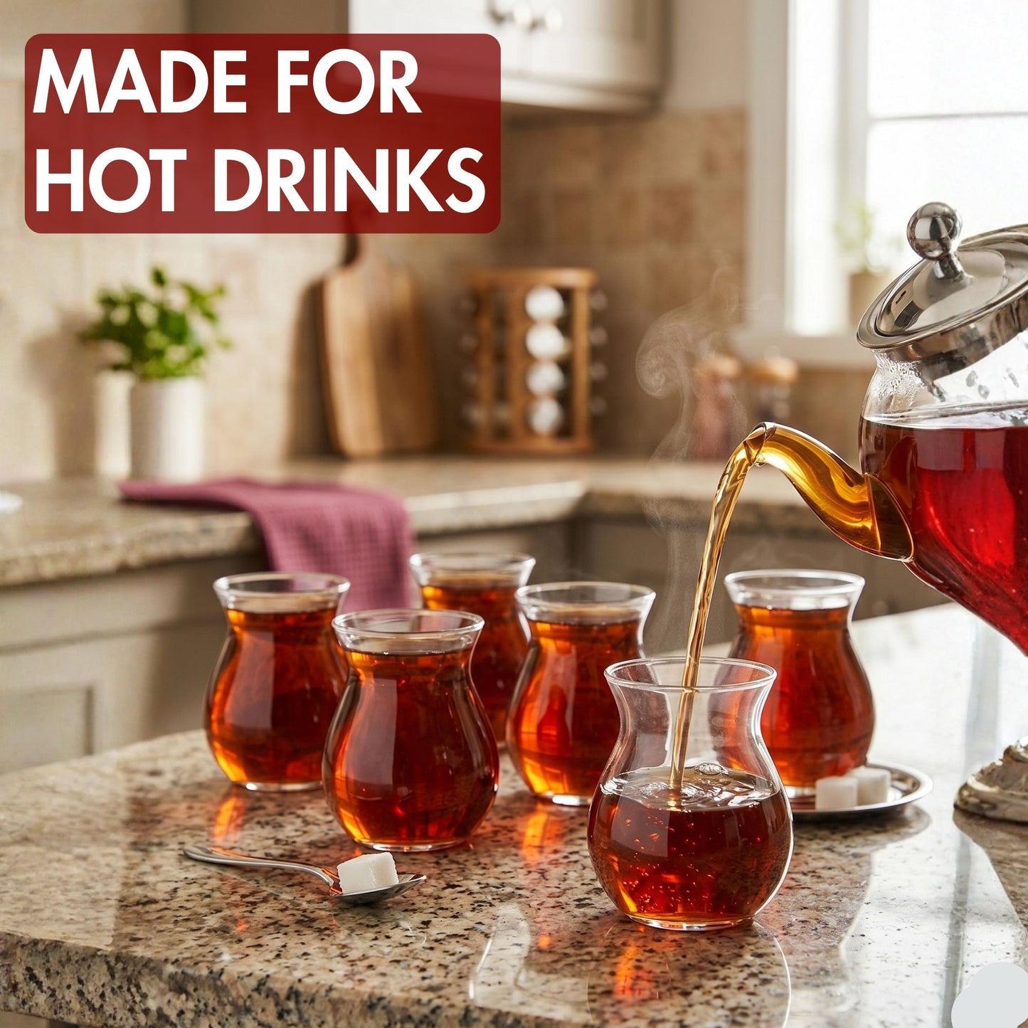 Tea being poured into glass cups on a kitchen counter with 'MADE FOR HOT DRINKS' text.