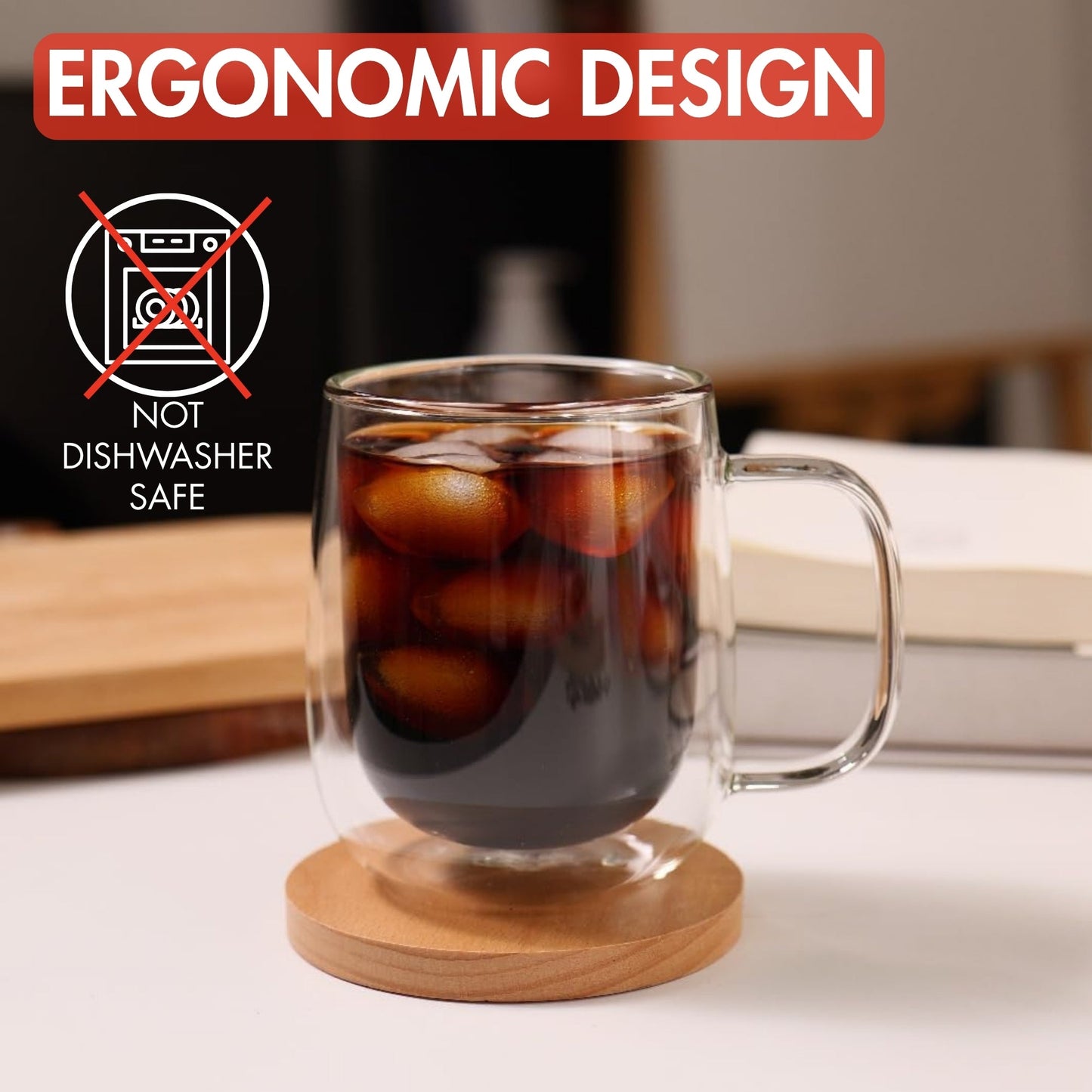Clear glass mug with iced coffee on a wooden coaster, with text about ergonomic design and dishwasher safety.