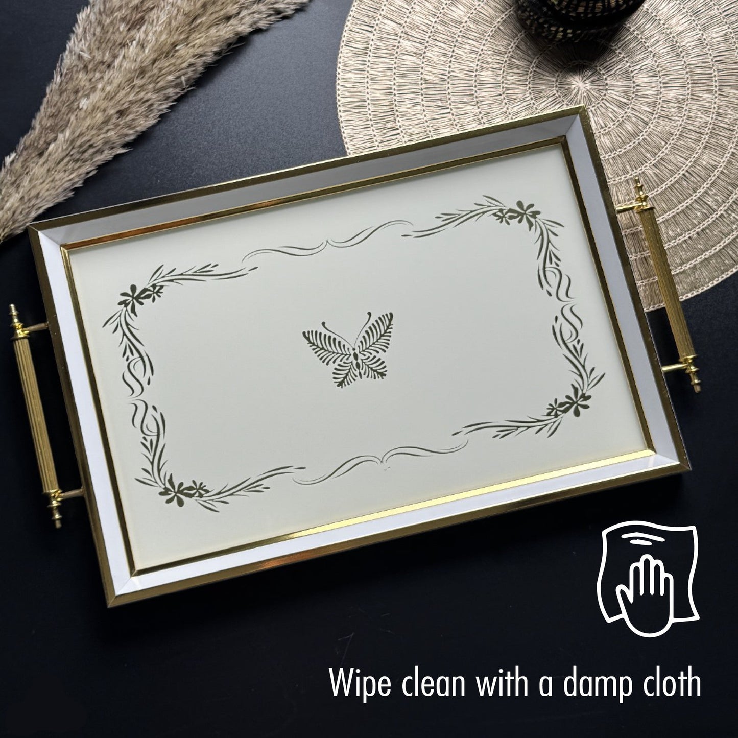 Decorative tray with butterfly design on a dark surface