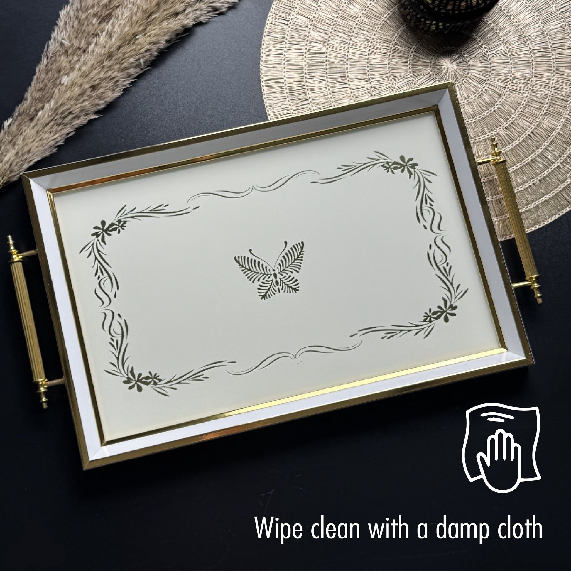 Decorative tray with butterfly design on a dark surface