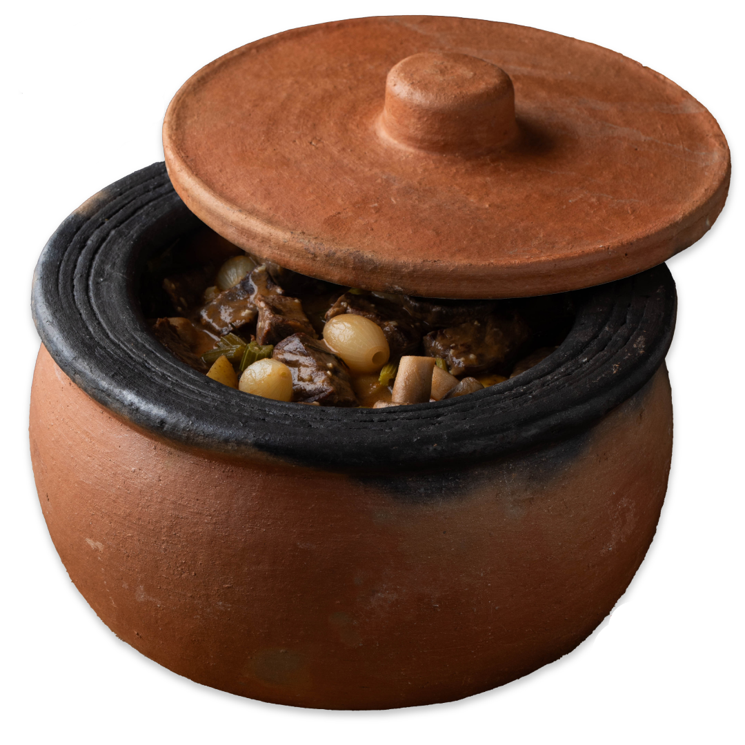 Terracotta pot with food inside, lid on, on a white background with 'Handmade in Anatolia' label.